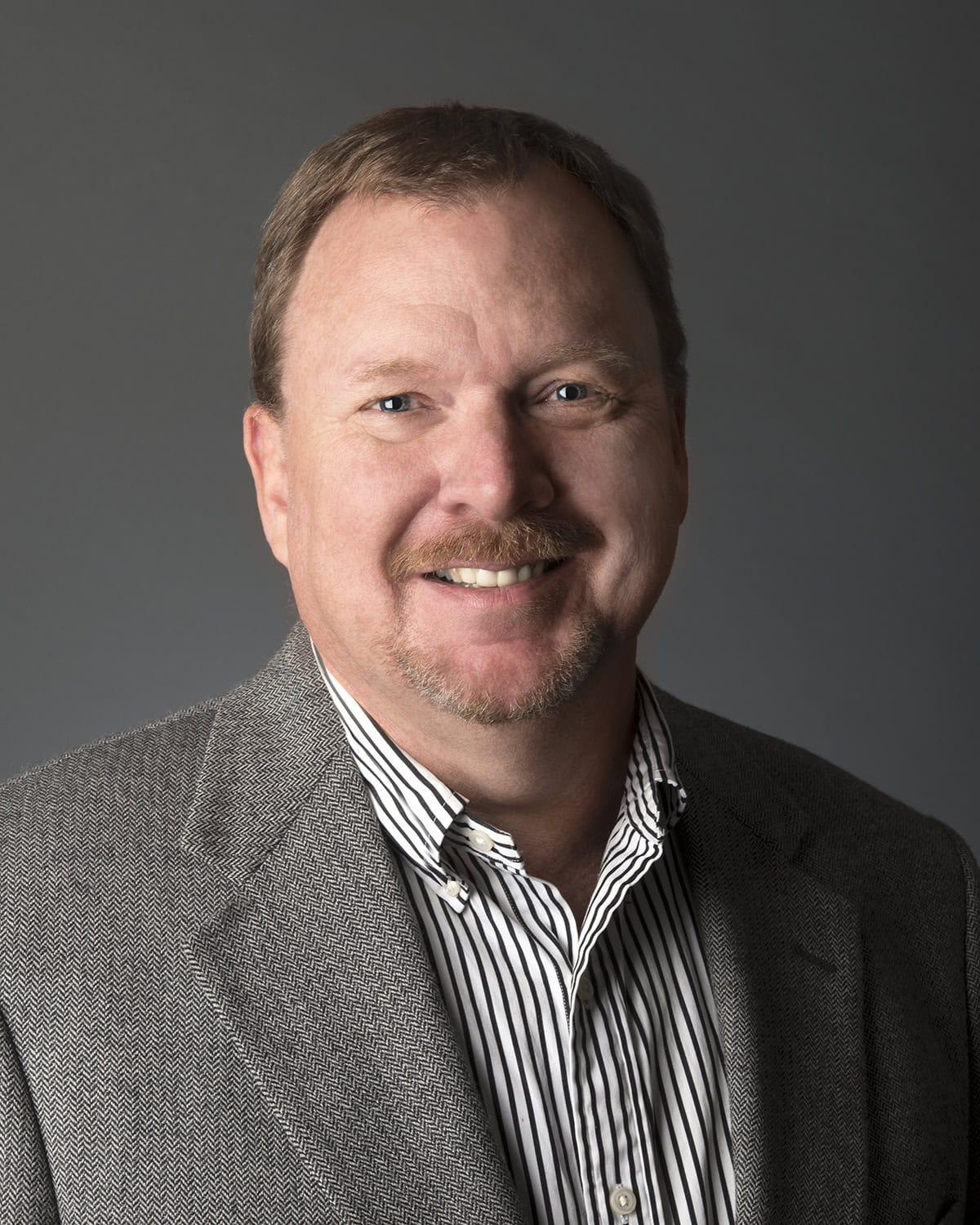 Professional mortgage advisor portrait.