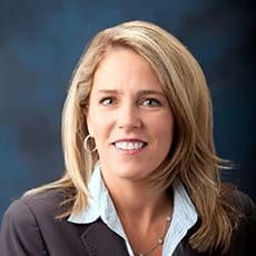 Professional portrait of Molly Speed, a mortgage expert at GMFS Partners, showcasing her friendly demeanor and expertise in home financing solutions.